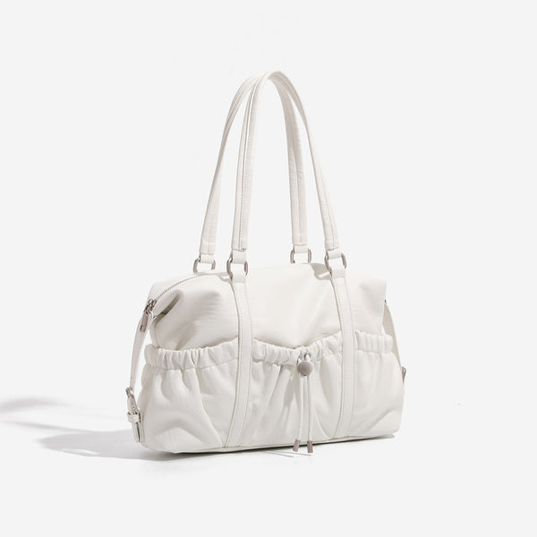 Ivory leather-look shoulder bag with ruched front panels, drawstring toggle, silver-tone hardware, and dual top handles