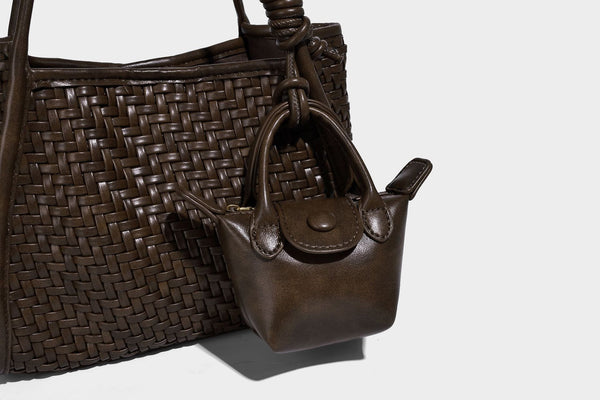 Woven texture open-top tote bag with smooth trim top handles and attached mini drawstring pouch in dark brown, detail view 20