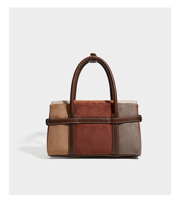 Structured color-block satchel bag in brown, rust, beige, and taupe suede-look panels with white topstitching, front buckle