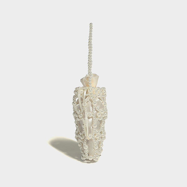 Small pearl-beaded lattice drawstring bucket bag with beaded shoulder strap and ribbon closure, detail view 18
