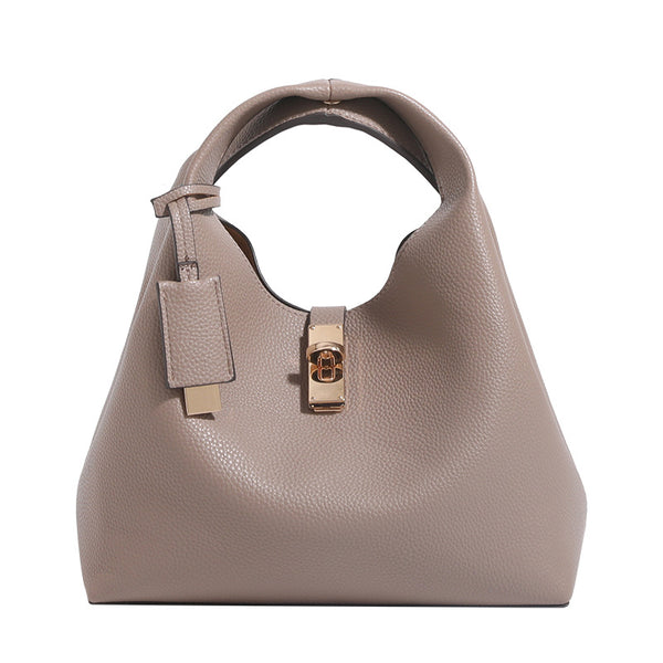 Structured pebbled leather-look bucket tote with gold-tone turn-lock hardware and looped top handle, detail view 5