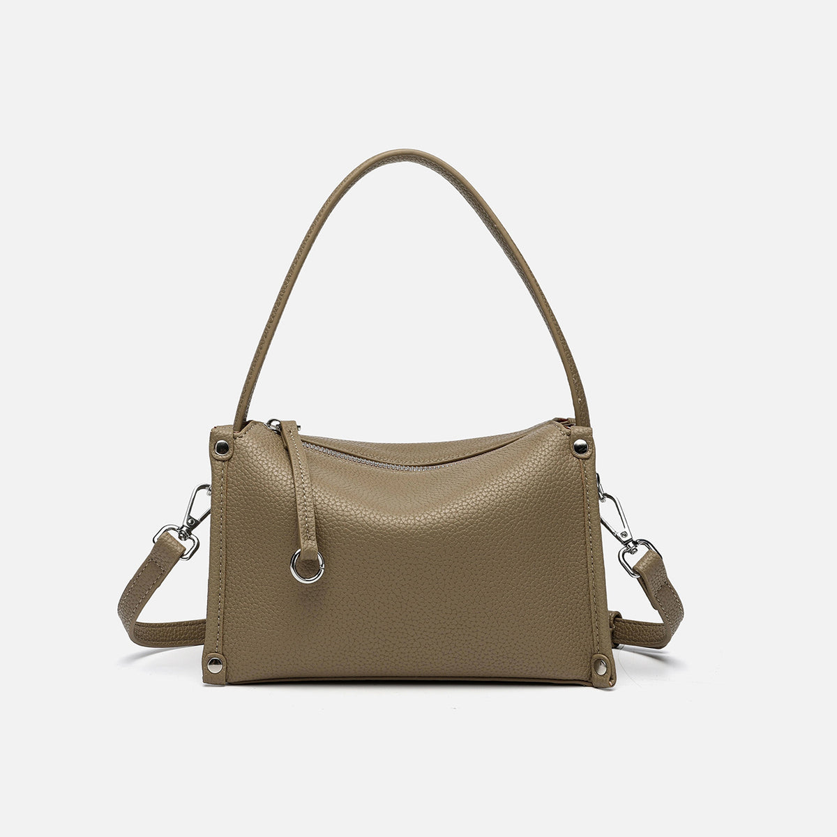 Small structured pebbled-finish convertible bag with silver corner studs, zip top, and detachable shoulder strap, detail view