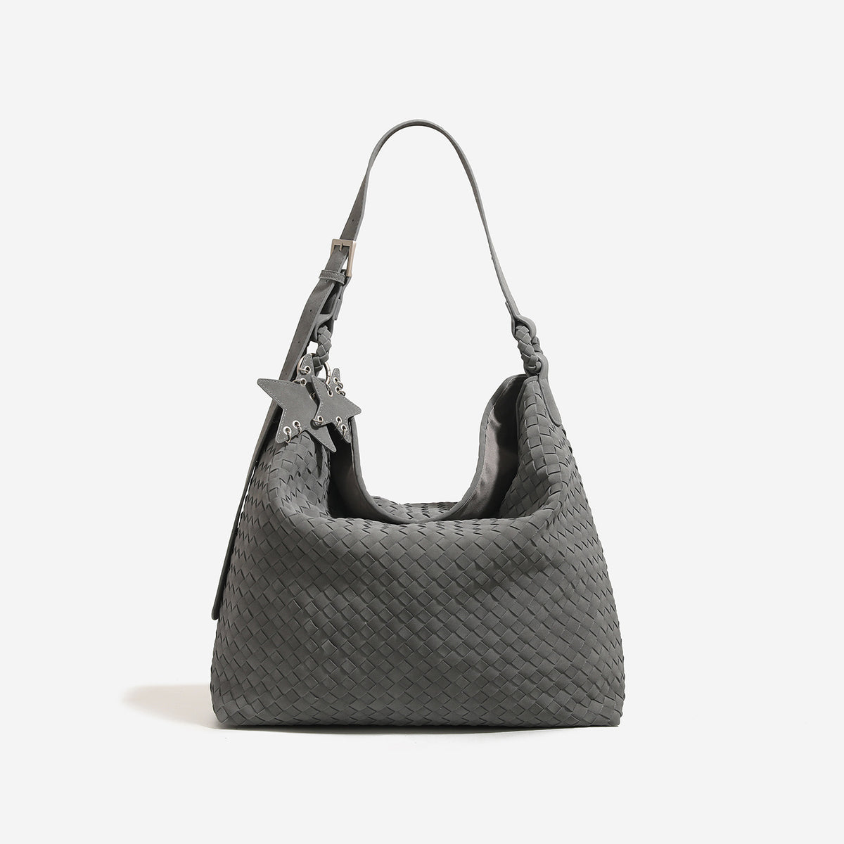 Slouchy woven hobo shoulder bag with matte suede-like finish, adjustable strap, and star charm hardware, detail view 6