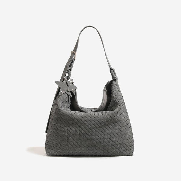 Slouchy woven hobo shoulder bag with matte suede-like finish, adjustable strap, and star charm hardware, detail view 6