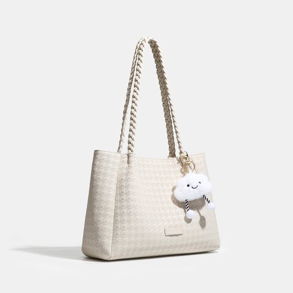 Structured geometric-embossed tote bag with braided shoulder straps and gold-tone hardware in ivory, detail view 2