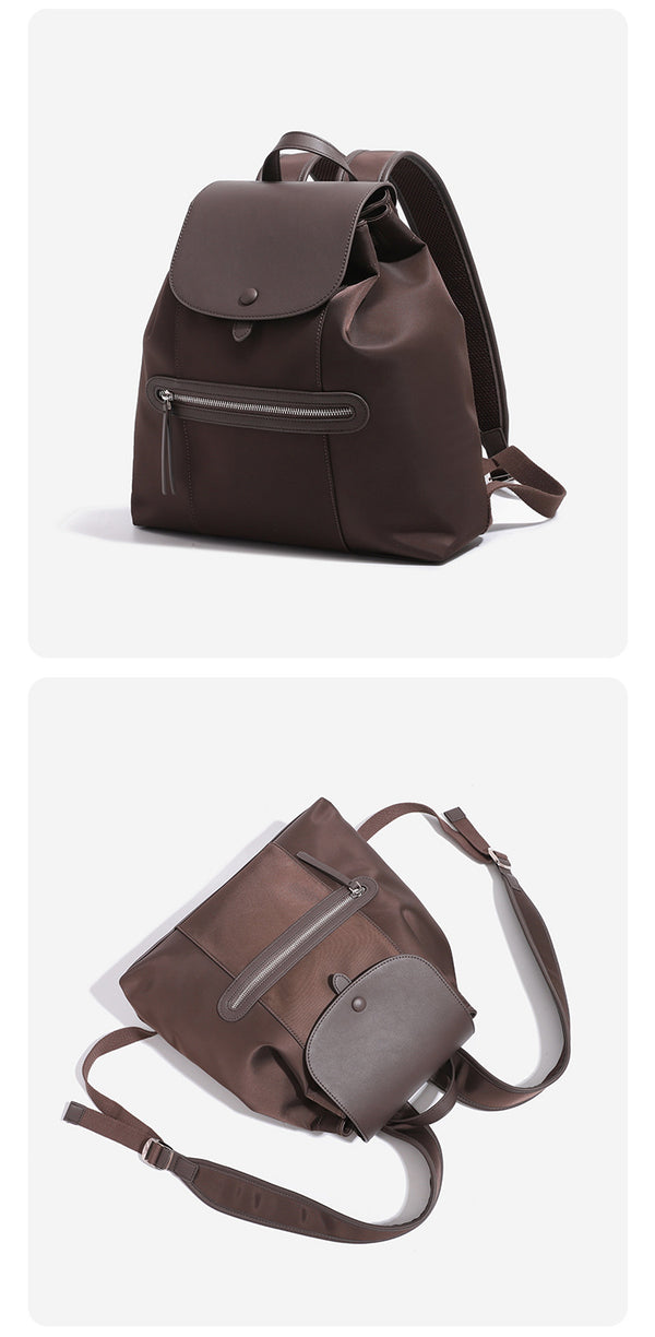Large flap-top nylon backpack with leather-look trim, snap closure, front zip pocket, and padded shoulder straps, detail view