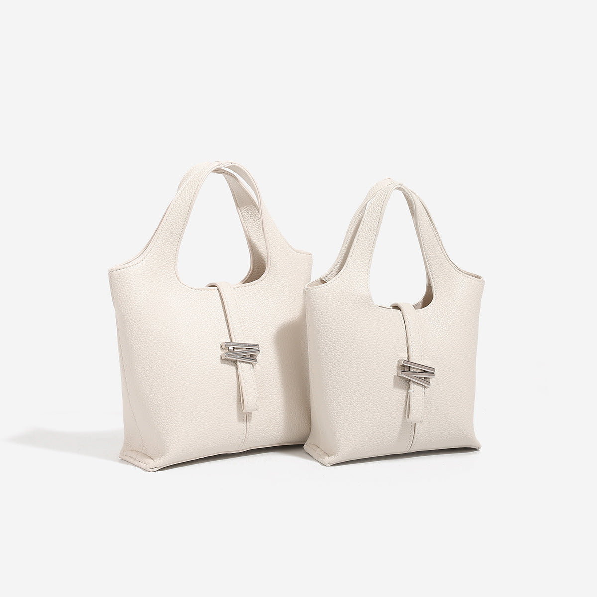 Mini pebbled leather-look bucket tote with silver toggle clasp and dual top handles, detail view 2