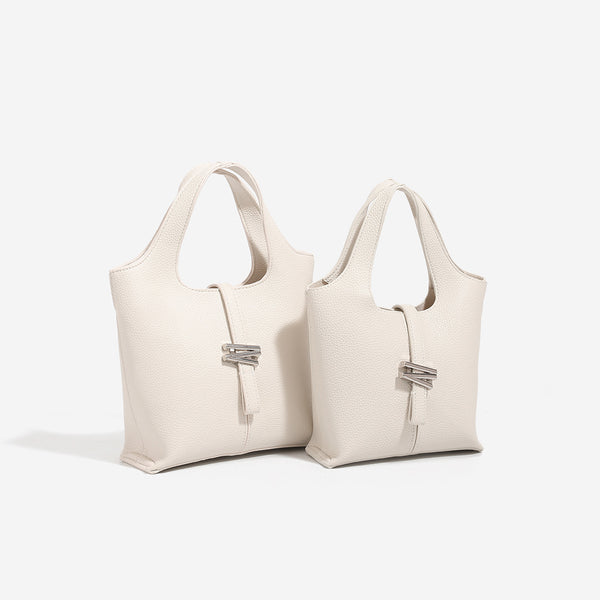 Mini pebbled leather-look bucket tote with silver toggle clasp and dual top handles, detail view 2