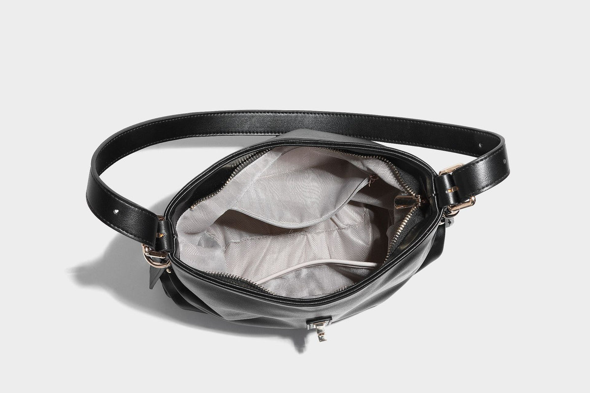 Soft slouchy hobo shoulder bag with smooth leather-look finish, gold-tone buckle and tab hardware, and long adjustable strap