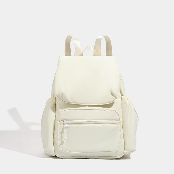Soft matte nylon flap backpack with front zip pocket and side drawcord pockets, detail view 6