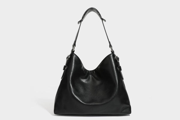 Large slouchy hobo shoulder bag in dark brown with smooth leather-look finish, adjustable strap, and silver-tone hardware