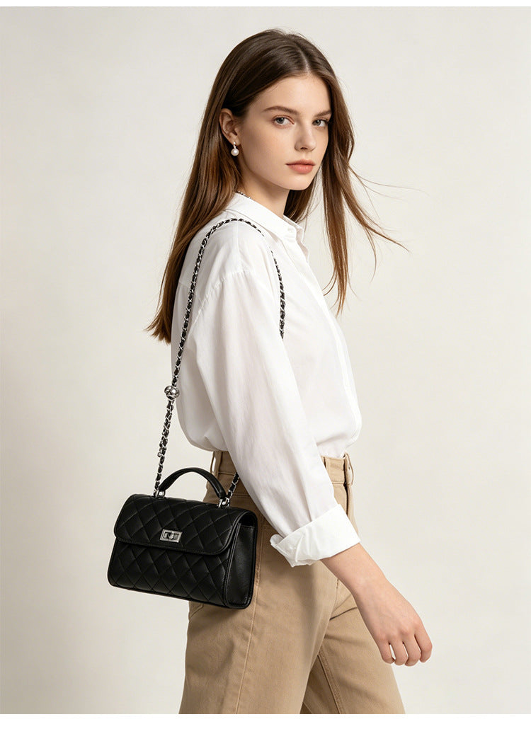 Small structured diamond-quilted flap satchel bag with silver-tone chain strap and turn-lock closure, detail view 11