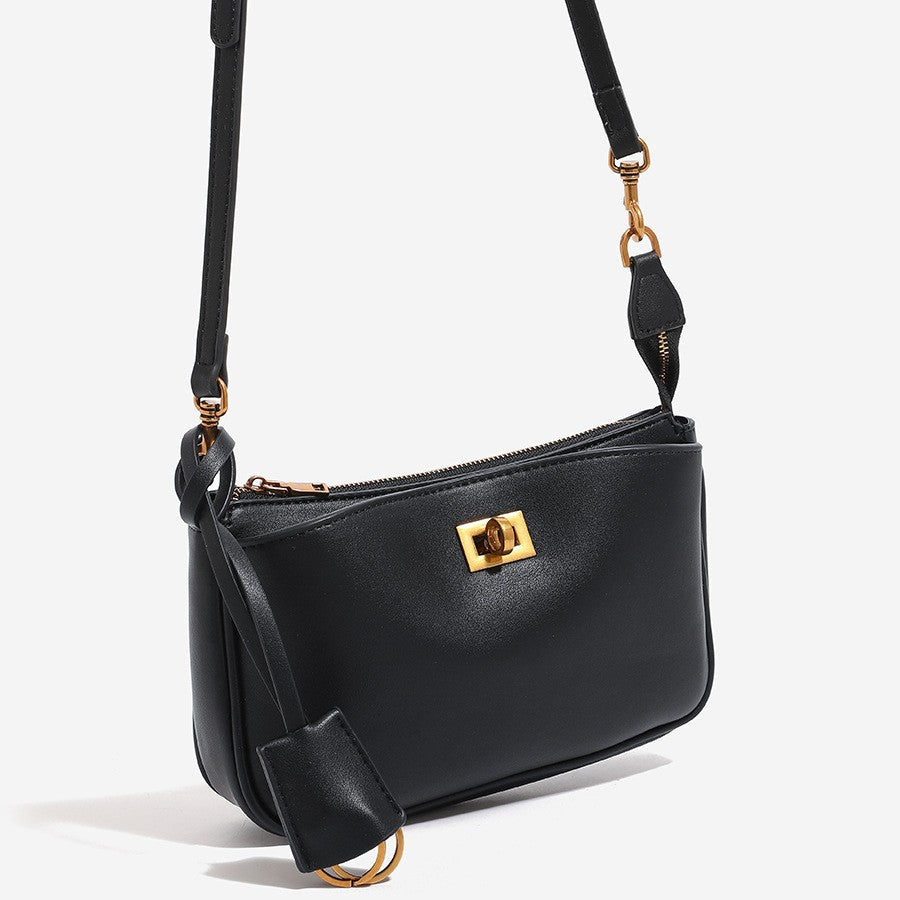 Small structured smooth leather-look shoulder bag with turn-lock front pocket and adjustable strap, detail view 2