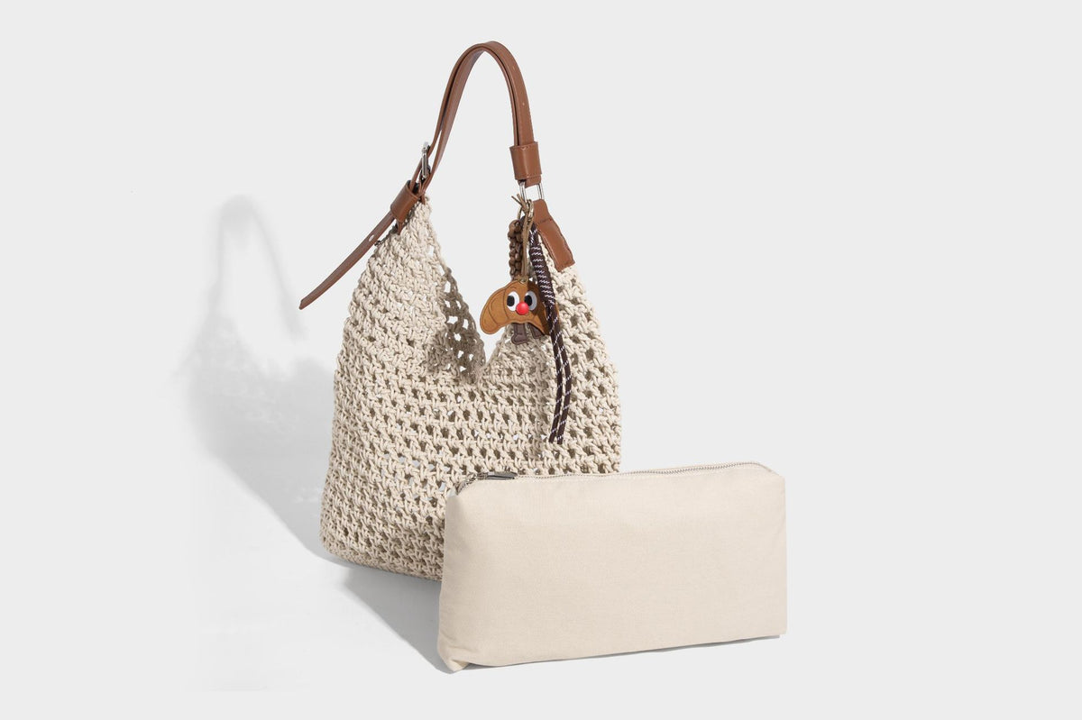 Slouchy open-knit crochet hobo tote bag with leather-look top handle and metal buckle hardware, detail view 16