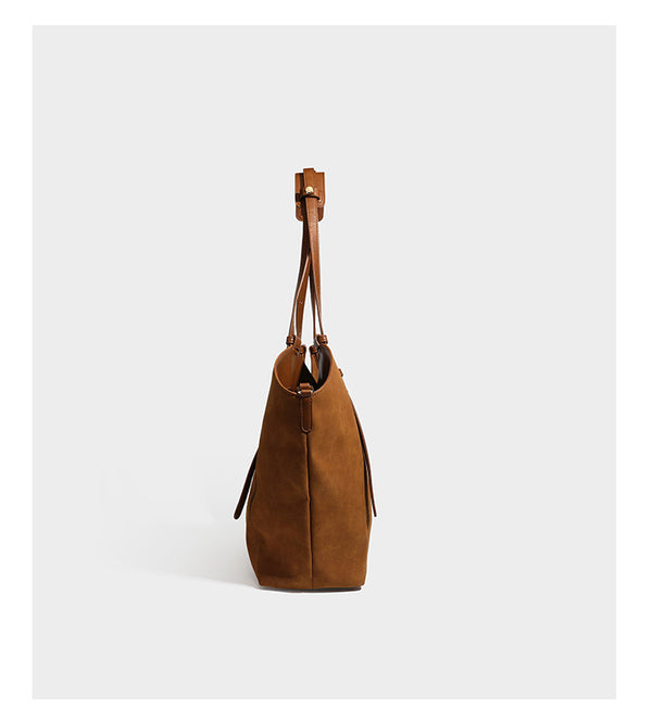 Oversized suede-finish tote shoulder bag in caramel brown with slim leather-look straps and gold-tone logo hardware, detail