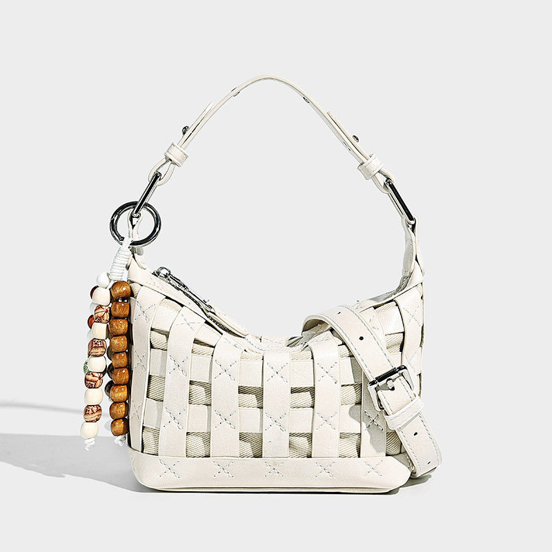 Small woven convertible shoulder bag with top zipper, silver-tone hardware, and detachable crossbody strap, detail view 6