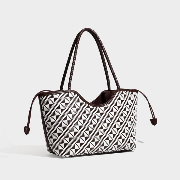 Woven geometric two-tone tote bag with braided shoulder straps and leather-look trim, front view