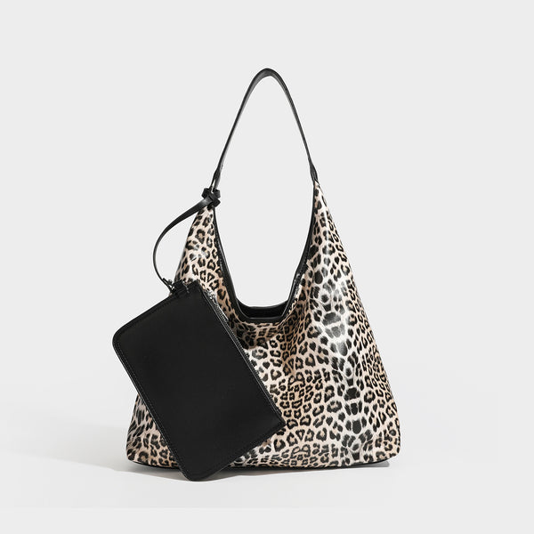 Glossy leopard-print slouchy shoulder bag with long strap and detachable tan zip pouch, detail view 3