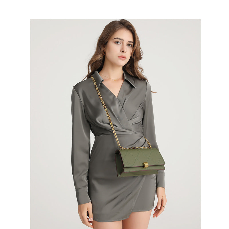 Structured quilted flap crossbody bag with gold-tone chain strap and turn-lock closure, detail view 2