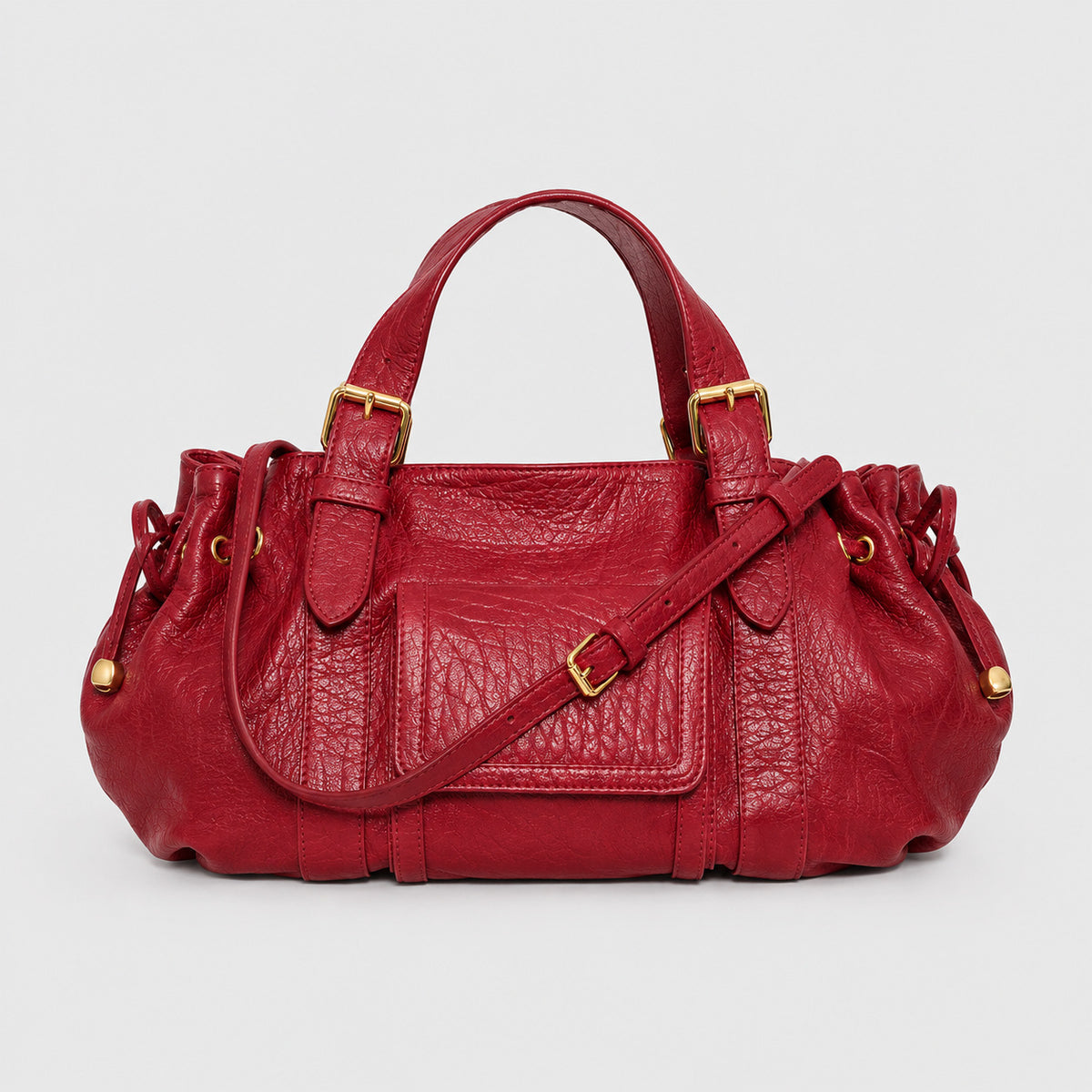 Black crinkled gloss leather-look satchel bag with drawstring sides, front buckle pocket, dual top handles, and gold-tone
