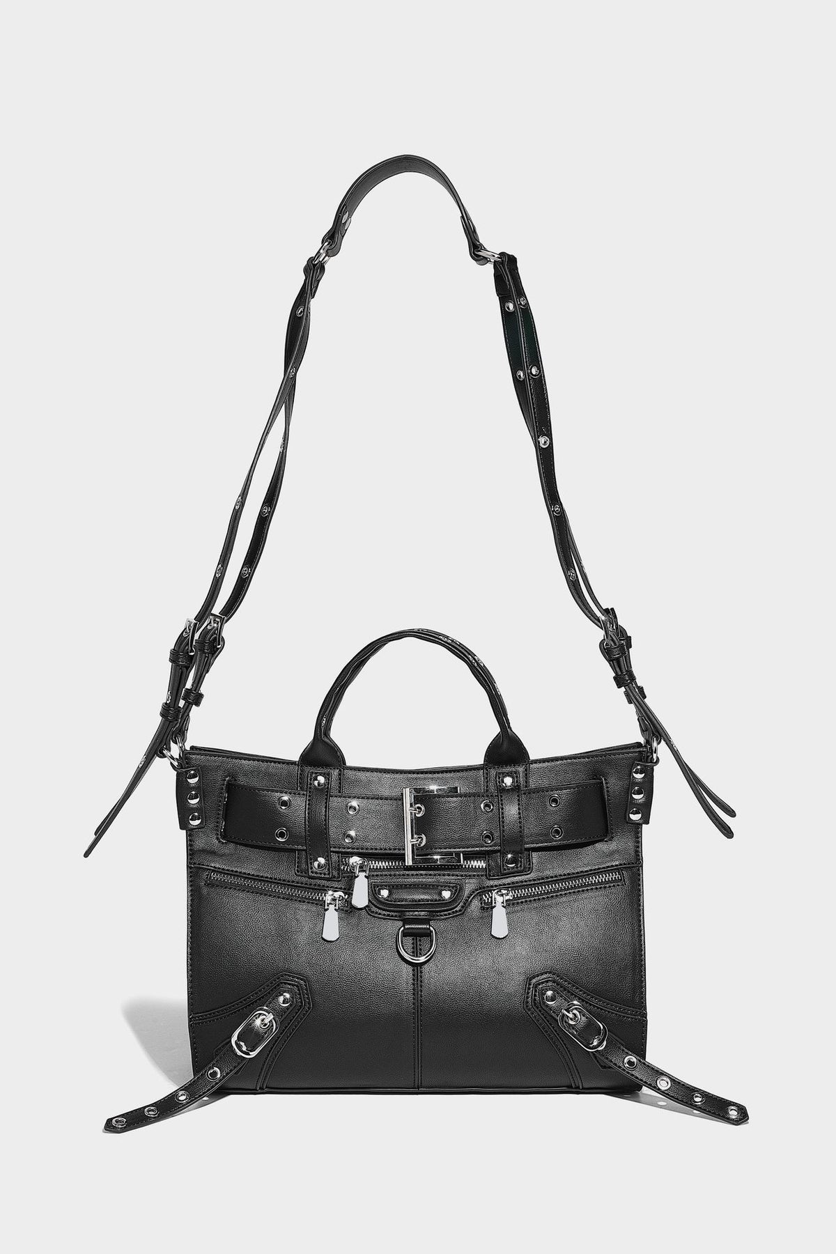 Black structured rectangular satchel bag with silver-tone rivets, large front buckle strap, zip pockets, dual top handles