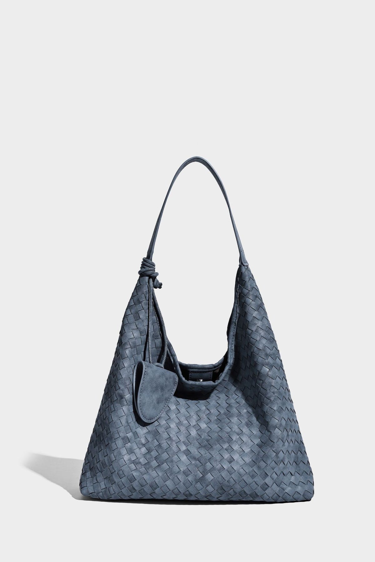 Slouchy woven hobo shoulder bag with knotted strap and matte leather-look textured finish, detail view 15