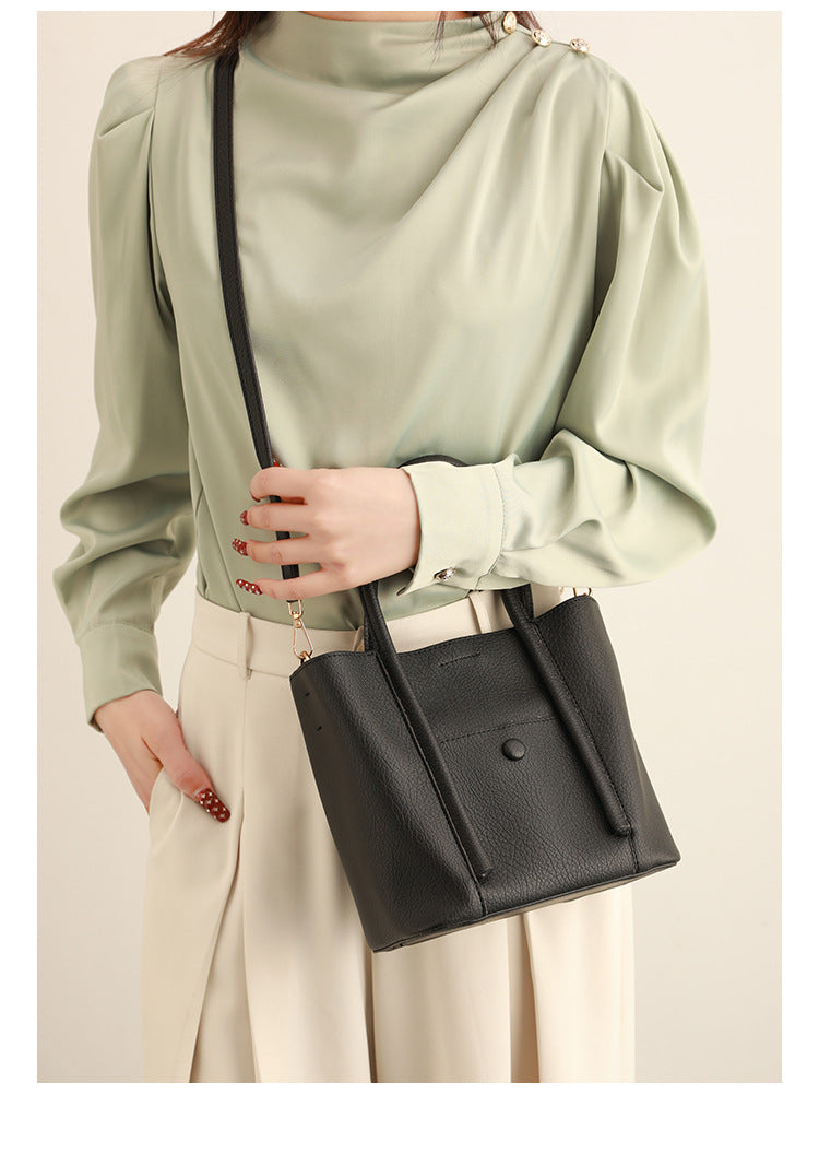 Structured pebbled matte tote bag with front snap pocket, dual top handles, and detachable zip pouch in almond beige, detail