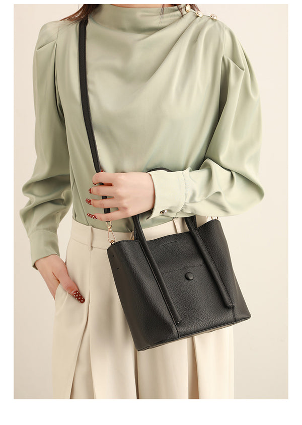 Structured pebbled matte tote bag with front snap pocket, dual top handles, and detachable zip pouch in almond beige, detail