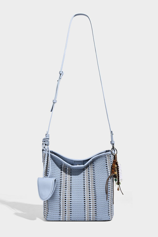 Woven bucket shoulder bag with leather-look trim, silver-tone hardware, and beaded tassel charm, detail view 41