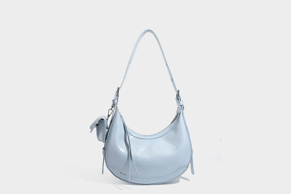 Glossy leather-look crescent hobo shoulder bag with dark contrast trim, silver-tone hardware, and attached mini flap pouch