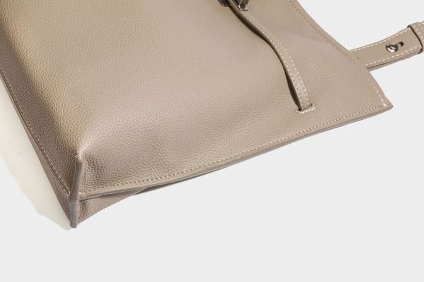 Pebbled leather-look tote bag with front toggle hardware and long shoulder strap, detail view 28