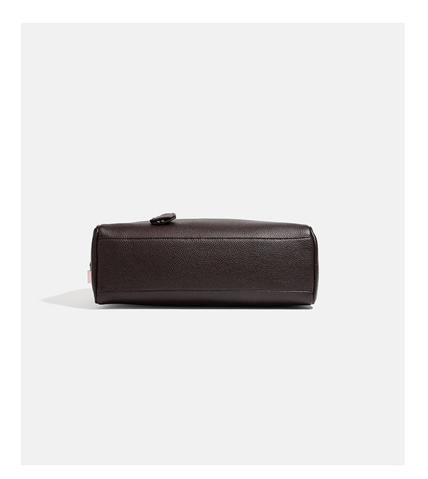 Structured rounded rectangular shoulder bag with pebbled leather-look finish, dual long handles, top zipper, front zip