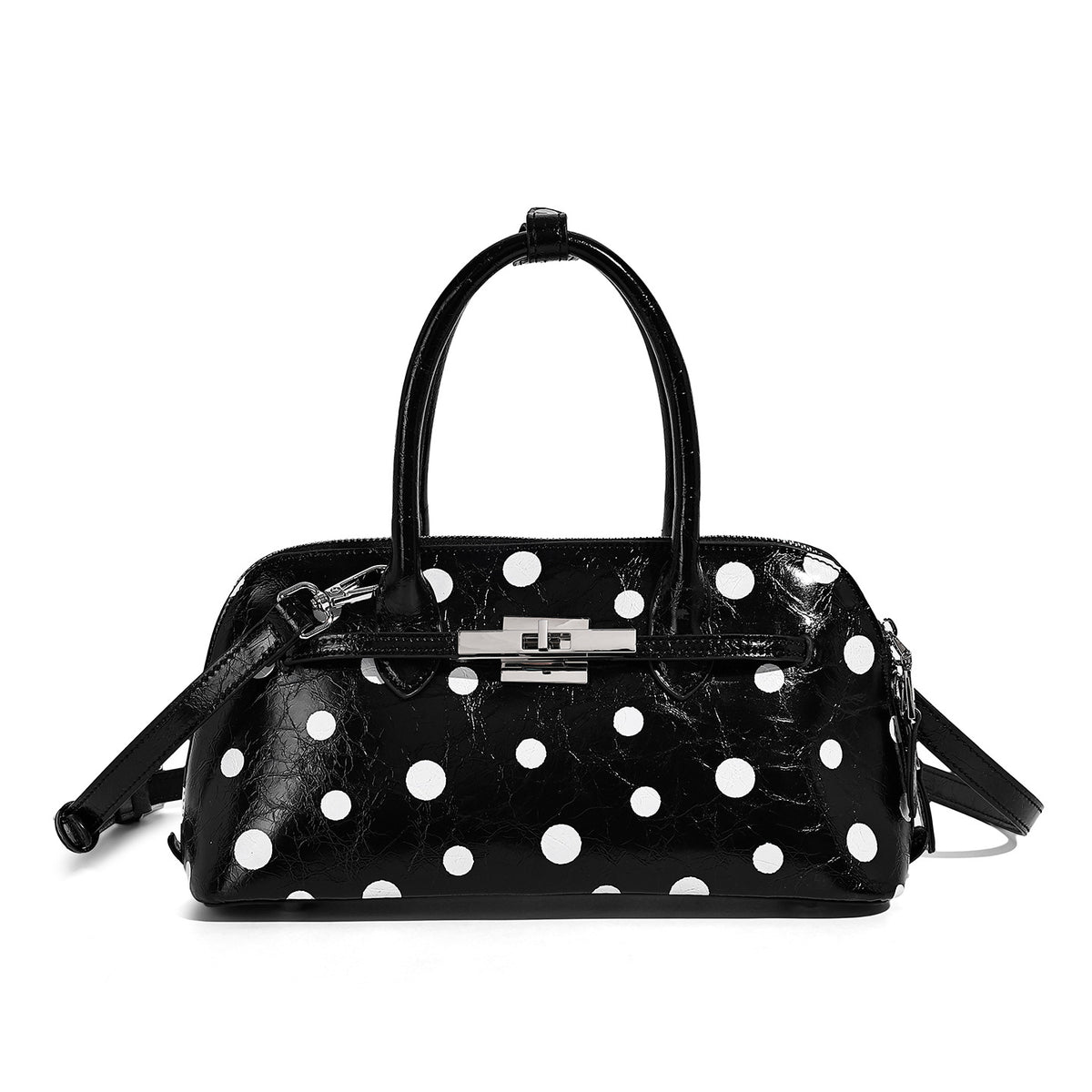 Glossy structured polka-dot satchel bag with dual top handles, silver turn-lock hardware, and detachable shoulder strap