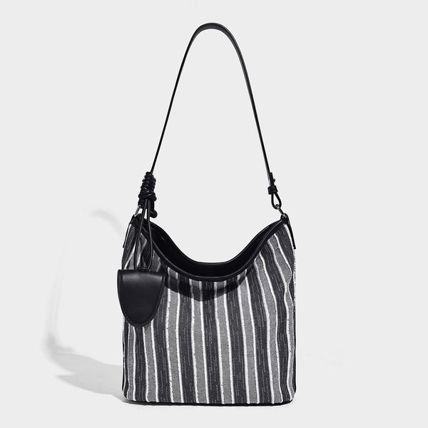 Large striped canvas hobo shoulder bag with cream trim and silver-tone hardware, detail view 7