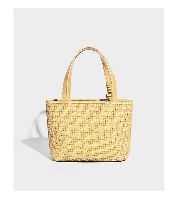 Kleine, formstabile Tote-Bag in gewebter Lederoptik mit geknoteten Henkeln, abnehmbarem Schulterriemen und einem hängenden Mini-Täschchen an der Vorderseite