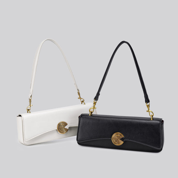 Structured rectangular flap bag with gold-tone circular turn-lock closure and detachable crossbody strap, front view