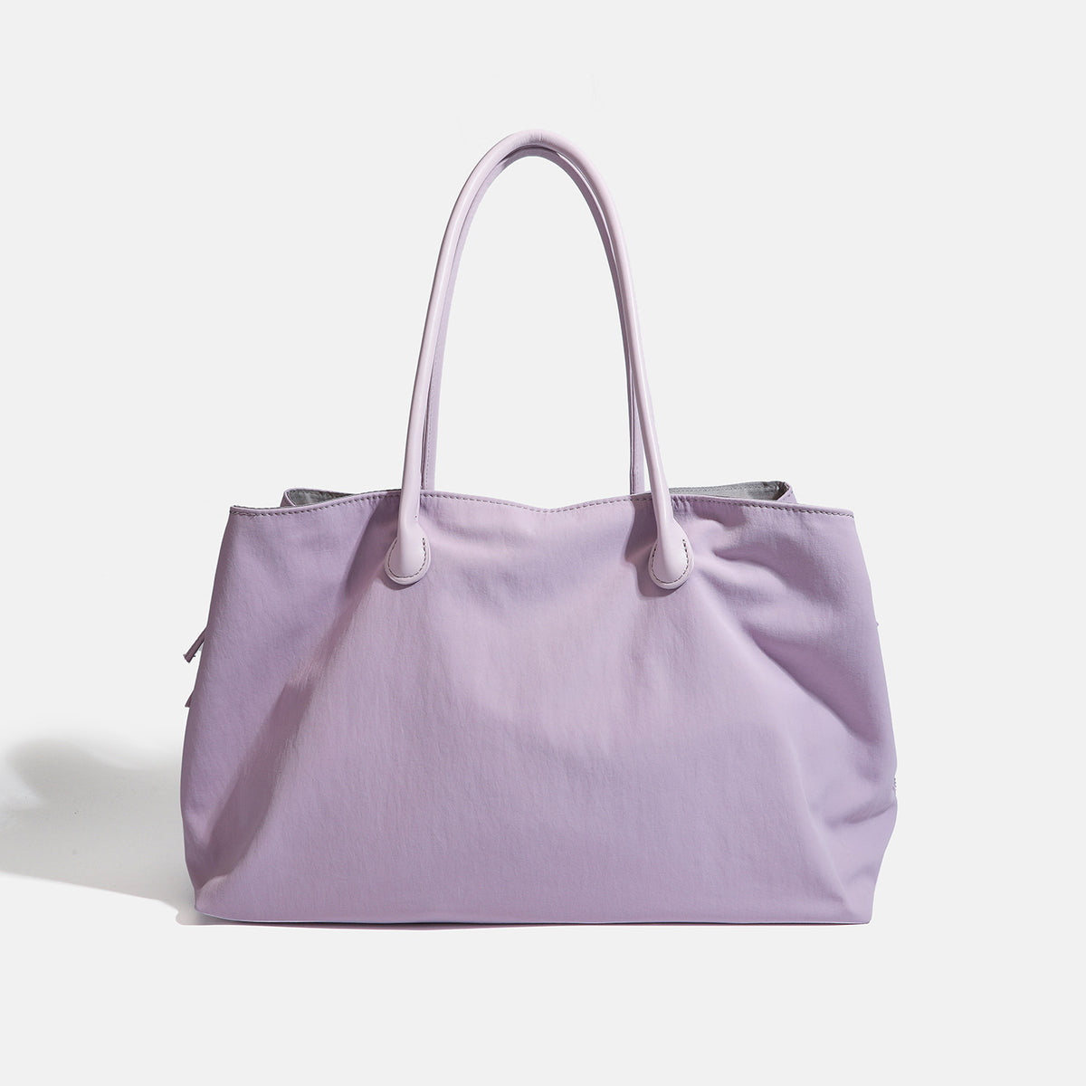Large soft nylon tote bag with long double handles and zippered top in lavender, front view