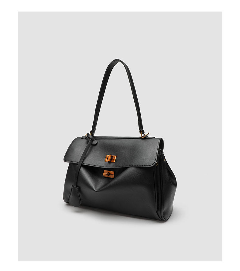 Structured black leather-look flap satchel bag with silver turn-lock hardware and top handle, detail view 21