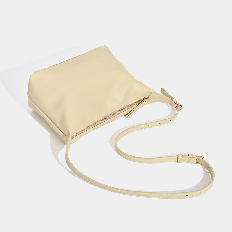 Soft slouchy zip shoulder crossbody bag with smooth matte leather-look finish and gold-tone hardware, detail view 4