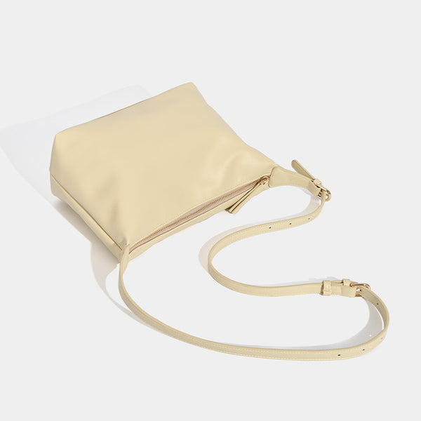 Soft slouchy zip shoulder crossbody bag with smooth matte leather-look finish and gold-tone hardware, detail view 4