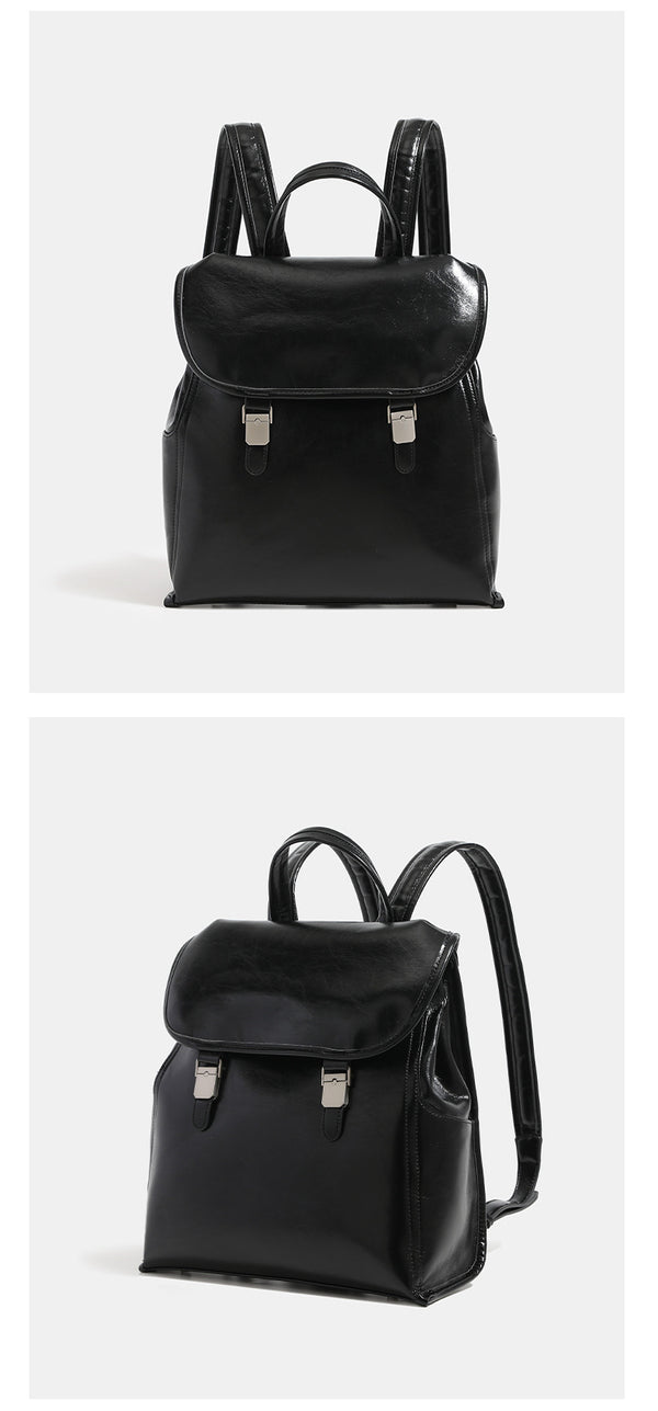Structured glossy leather-look flap backpack with twin buckle closures and top grab handle, detail view 13