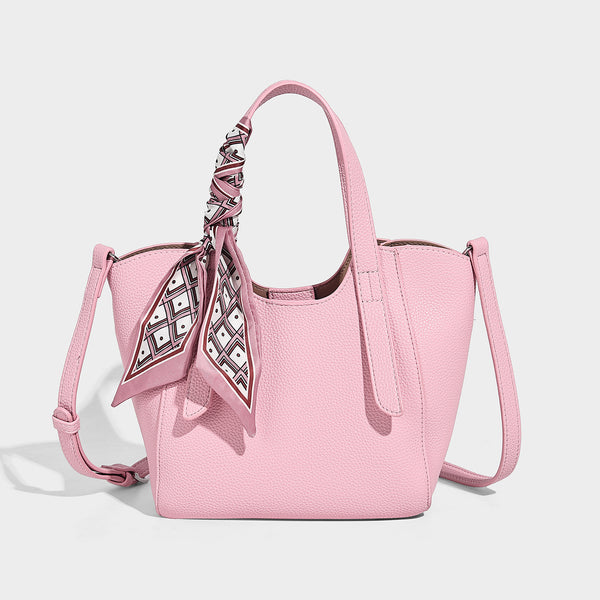 Structured pebbled leather-look tote bag with detachable scarf tie, dual top handles, and adjustable crossbody strap, detail