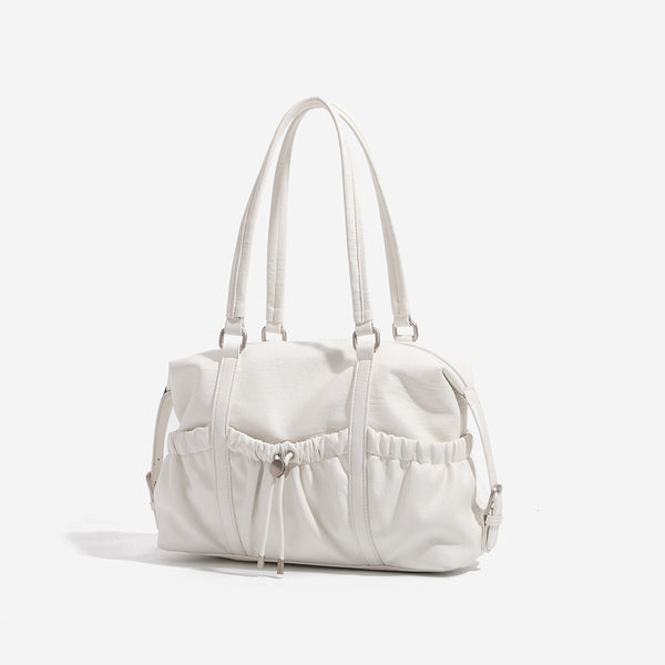 Ivory leather-look shoulder bag with ruched front panels, drawstring toggle, silver-tone hardware, and dual top handles