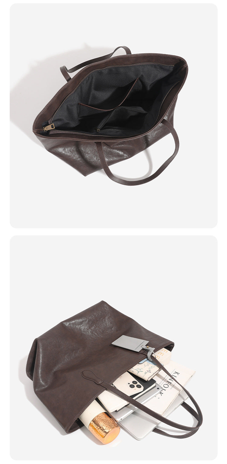 Large leather-look tote bag with trapezoid silhouette, double shoulder straps, and detachable hanging tag, detail view 15