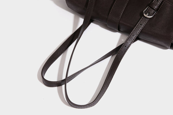 Large structured vintage-style tote bag with flap-front turn-lock closure, twin buckle straps, and double shoulder handles