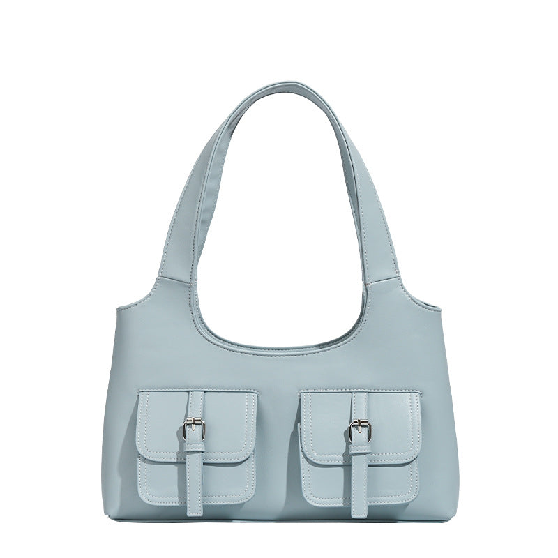 Powder blue structured tote bag with dual front flap buckle pockets and silver-tone hardware, detail view 5