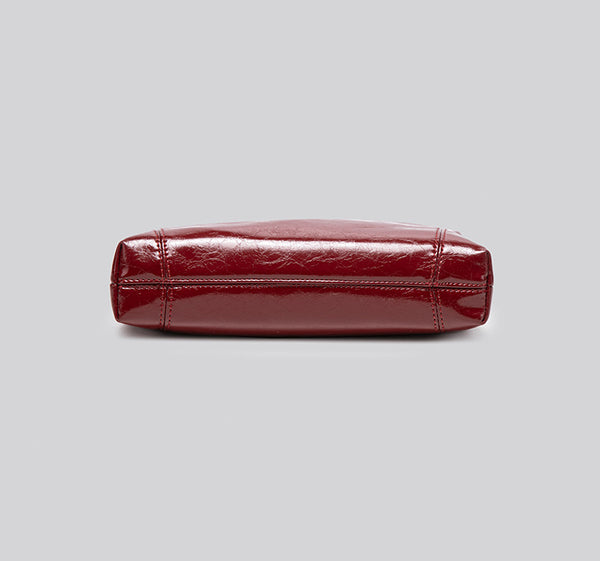 Glossy leather-look hobo shoulder bag with gold-tone chain-and-leather strap in deep burgundy red, detail view 12