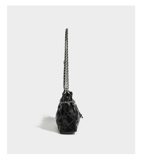 Glossy diamond-quilted drawstring bucket bag with silver chain shoulder strap and medallion charm, detail view 11