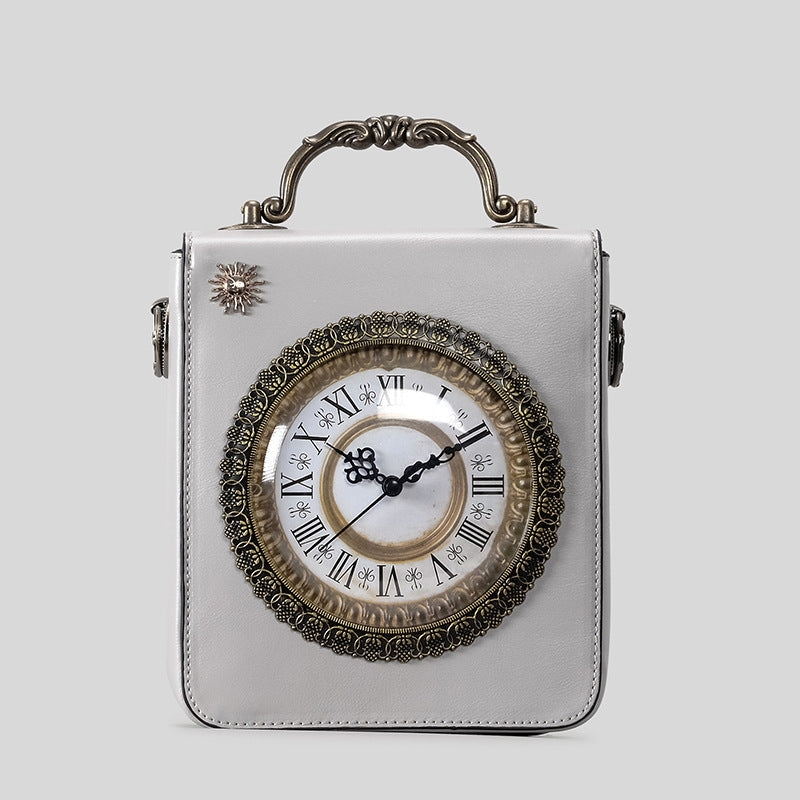 Small structured rectangular crossbody bag with ornate antique-style clock face and brass hardware in, detail view 9
