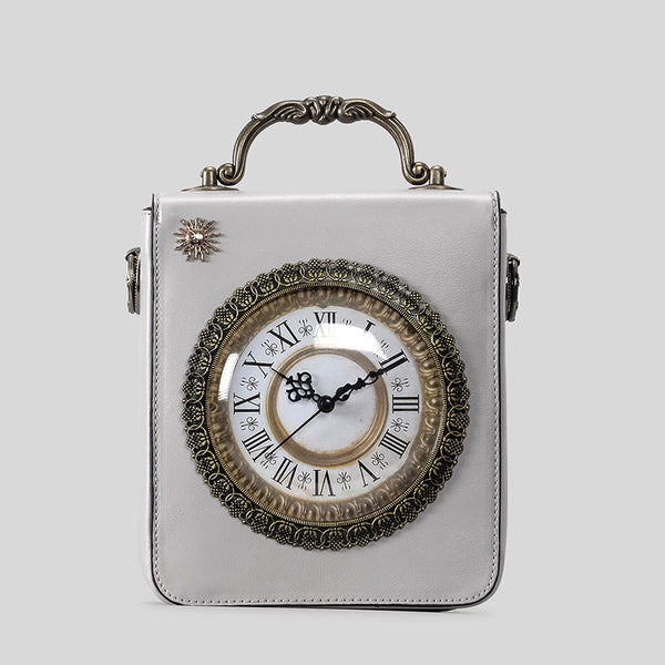 Small structured rectangular crossbody bag with ornate antique-style clock face and brass hardware in, detail view 9